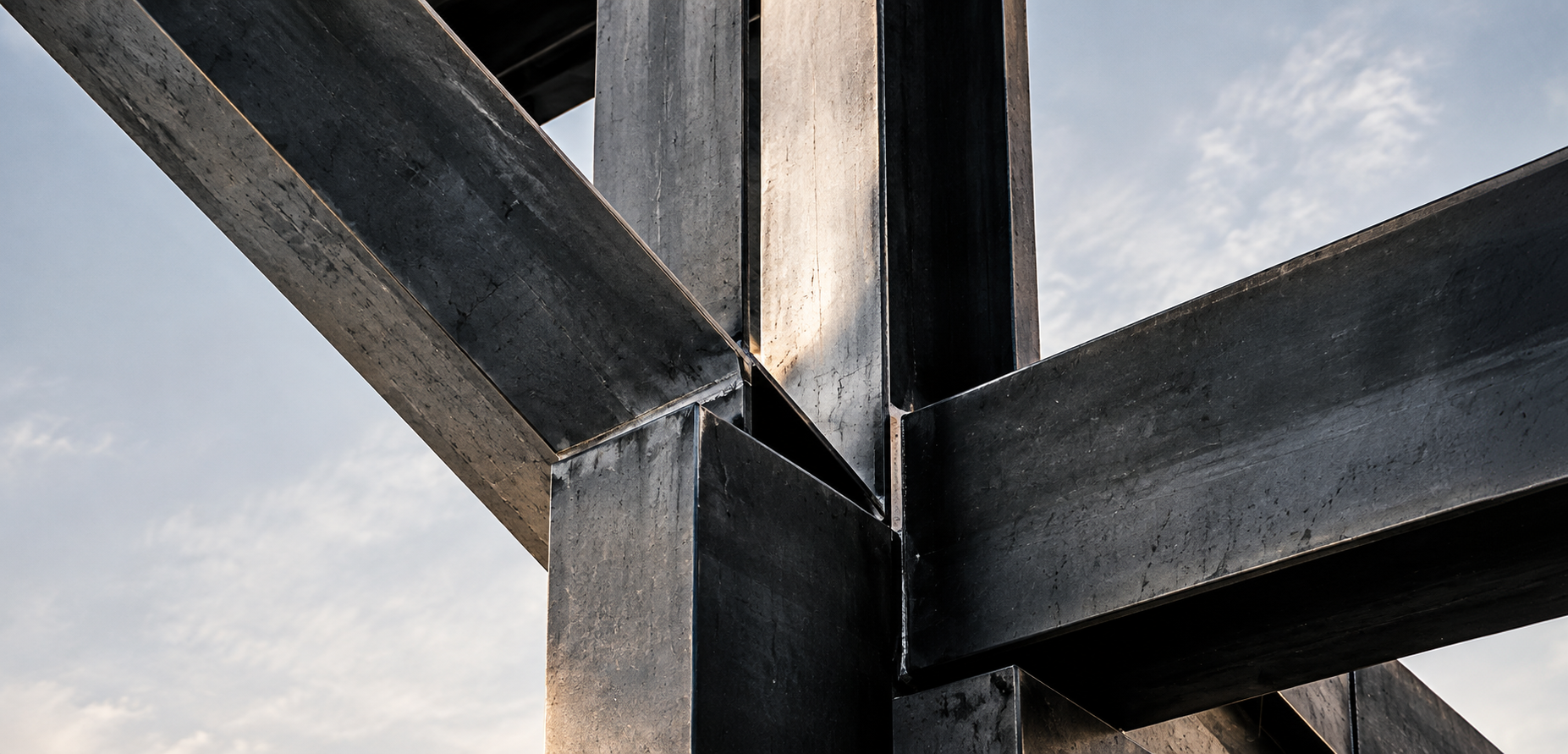 Steel beams of an industrial structure against the sky